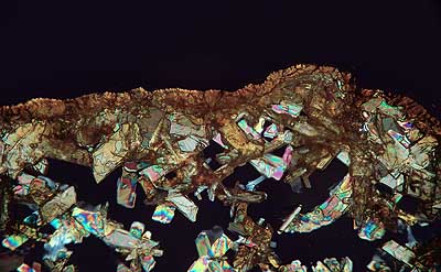 50 kb JPG microphoto of a precipitation crystal by Doug Craft